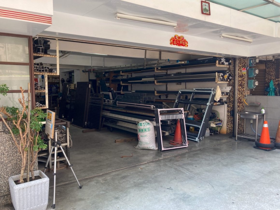 Material is stored in a shop that sells window frames and cages in New Taipei City.
