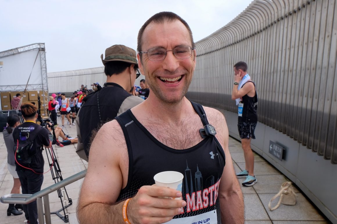 Alex Workman of the US poses for photo on the 91st floor observation deck.